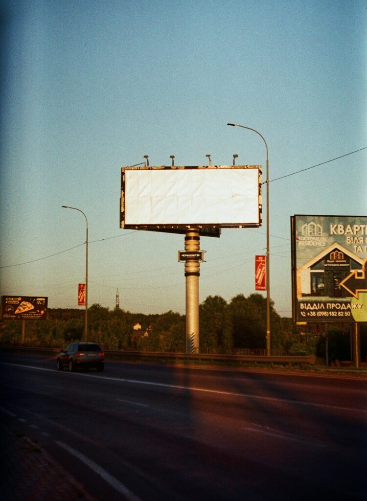 a billboard on the side of the road