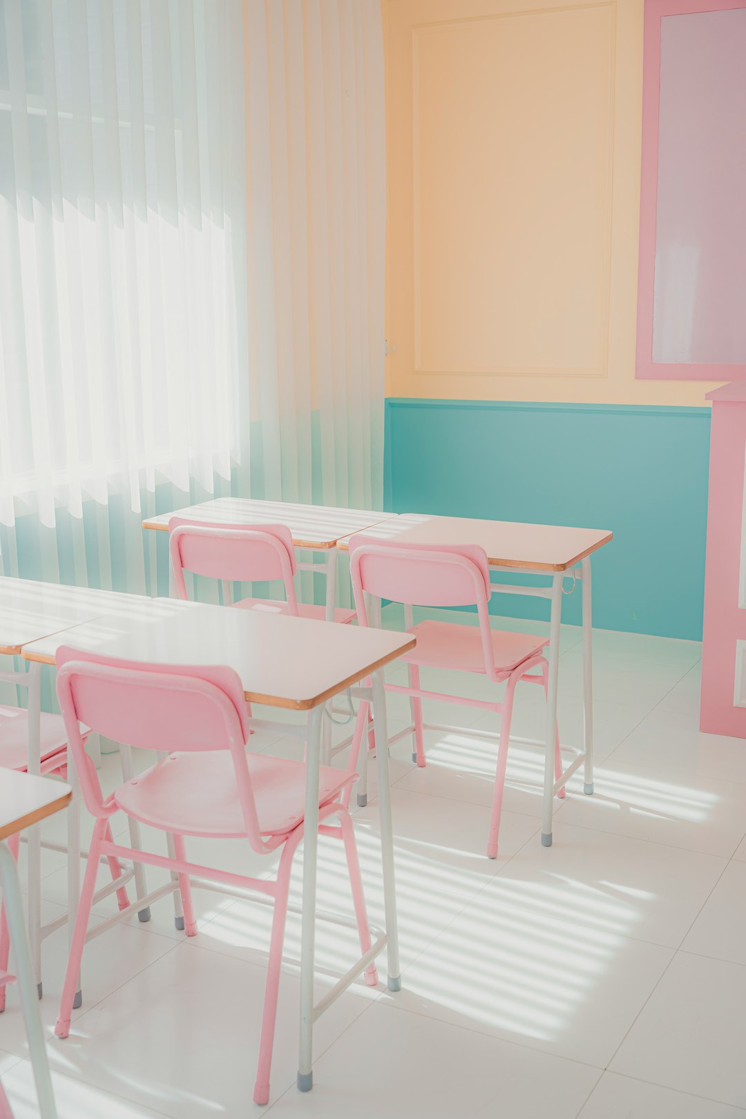 a room that has a bunch of pink chairs in it